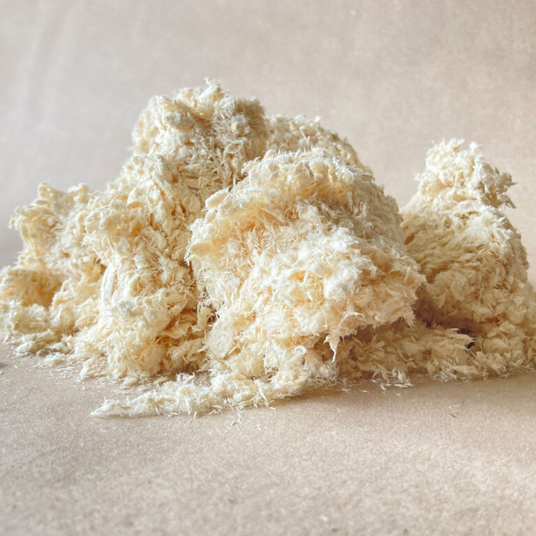 a pile of natural paper pulp absorbent that sucks up the oil